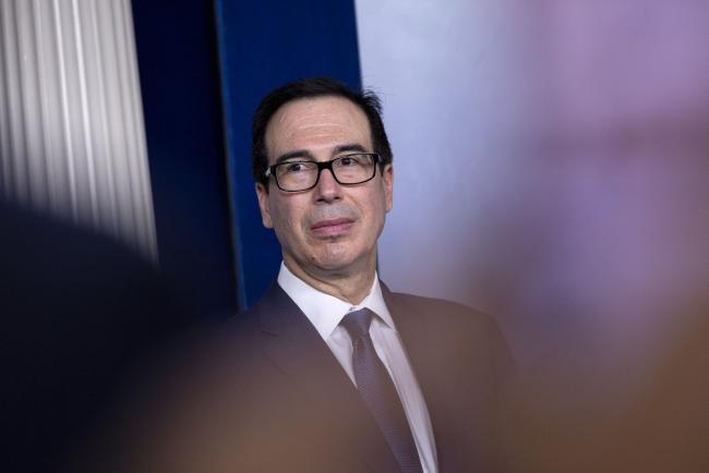 © Bloomberg. Steven Mnuchin, U.S. Treasury secretary, listens during a news conference in Washington, D.C., U.S., on Monday, March 9, 2020. President Donald Trump said Monday he will seek a payroll tax cut and 