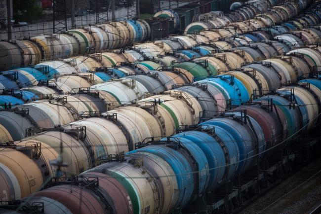 © Bloomberg. Rail wagons for oil, fuel and liquefied gas cargo stand in sidings at Yanichkino railway station, cose to the Gazprom Neft PJSC Moscow refinery in Moscow, Russia, on Monday, April 27, 2020. Oil prices plunged to within a whisker of $10 a barrel after a major index tracked by billions of dollars in funds bailed out of near-term contracts for fear prices may turn negative again. Photographer: Andrey Rudakov/Bloomberg