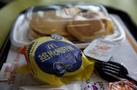 © Getty Images. A McDonald's 'Big Breakfast' and Egg McMuffin are displayed at a McDonald's restaurant, July 23, 2015, in Fairfield, California. McDonald's plans to begin serving breakfast all day across the United States.